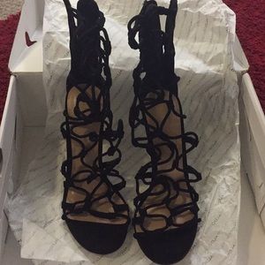Black tall strappy heeled open toe Aldo sandals